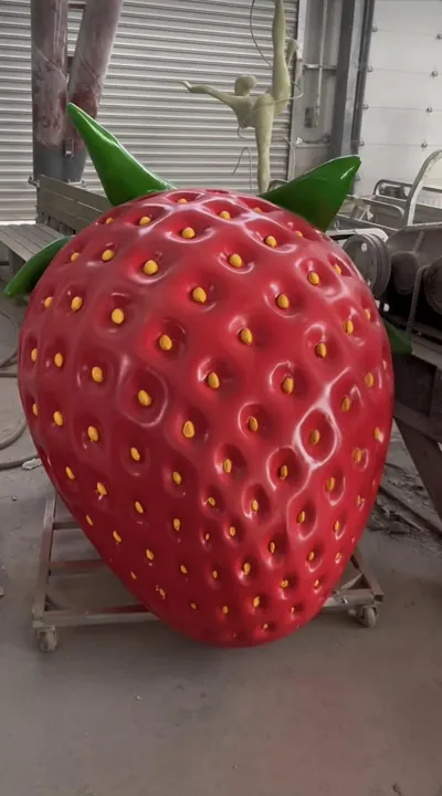 Giant glossy strawberry sculpture
