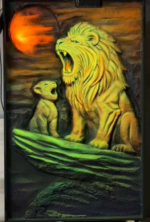 UV-glow carved relief of a lion and cub under black light