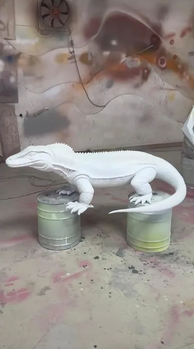 White primed monitor lizard sculpture in the paint shop
